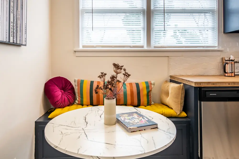 Unit A breakfast nook with a striped bench