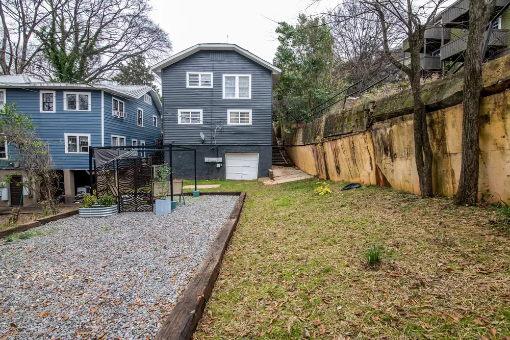 The back of the house and the Unit B parking pad